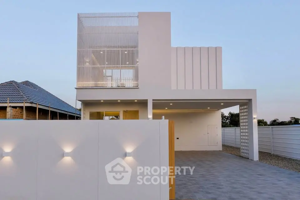Modern minimalist home exterior with sleek design and spacious driveway