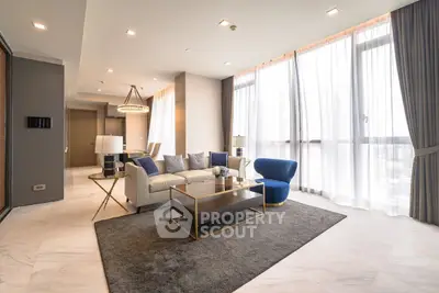 Luxurious modern living room with elegant decor and large windows
