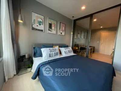 Modern bedroom with stylish decor and cozy bedding in a contemporary apartment.