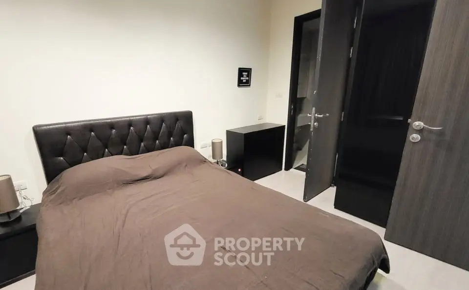 Cozy bedroom with modern decor and elegant furnishings in a stylish apartment.