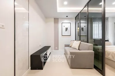 Modern living room with sleek design and glass partition