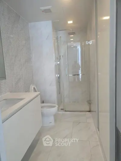 Modern bathroom with sleek design and glass shower enclosure