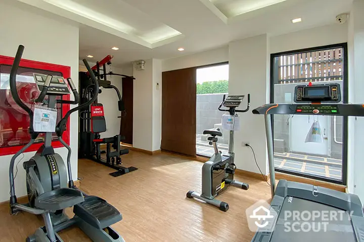 Modern gym with state-of-the-art fitness equipment and natural light