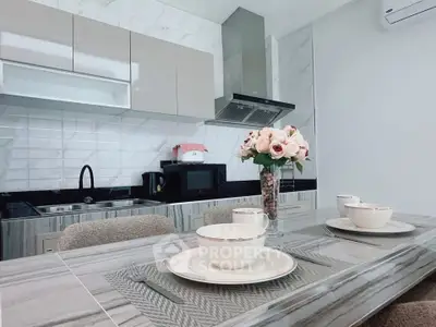 Modern kitchen with sleek countertops and elegant dining setup