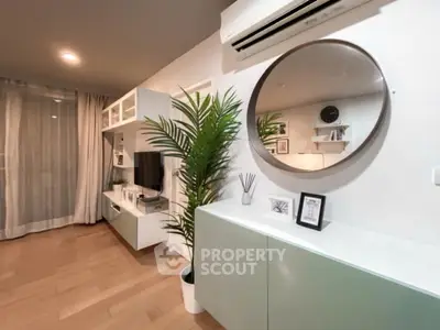 Modern living room with stylish decor and air conditioning