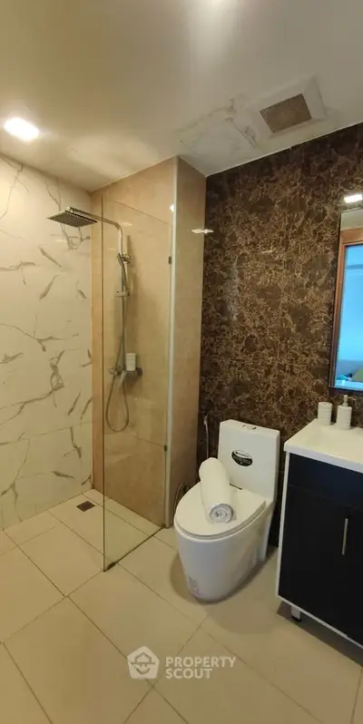 Luxurious modern bathroom with elegant marble accents and sleek fixtures