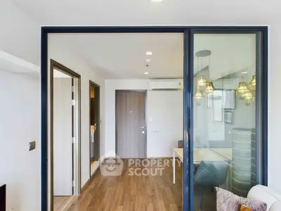 Modern apartment interior with sliding glass doors and stylish lighting