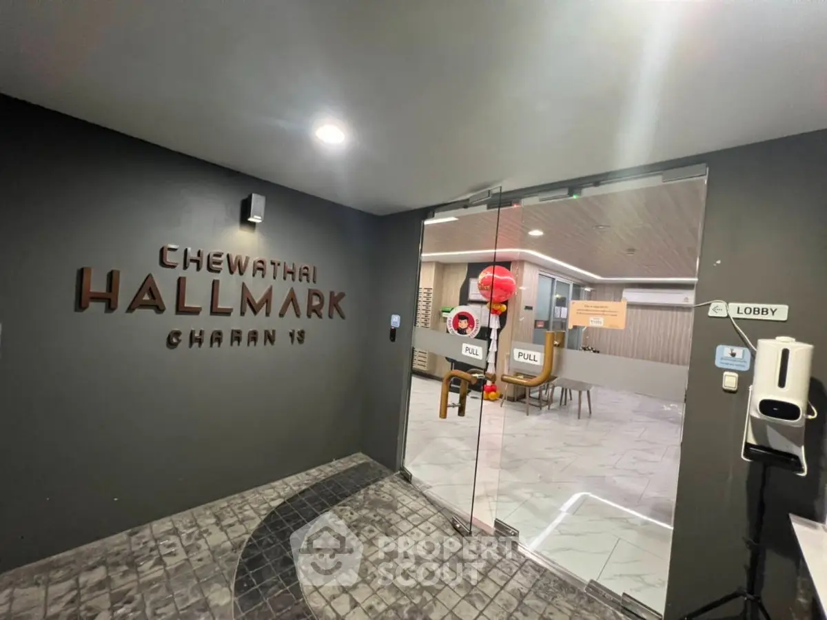 Modern lobby entrance with sleek design and glass doors at Chewathai Hallmark Charan 13.
