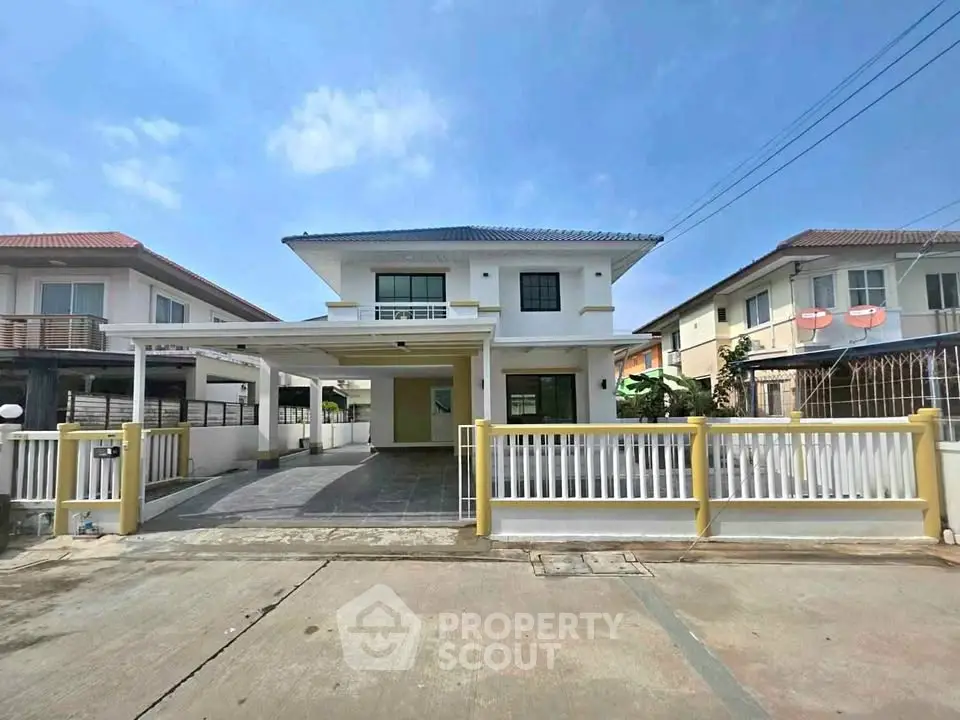 Charming two-story house with spacious driveway and modern design in a serene neighborhood.
