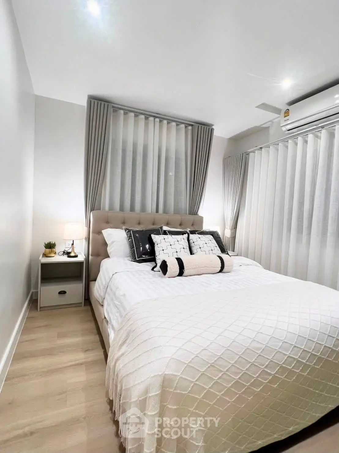 Cozy modern bedroom with elegant decor and natural light