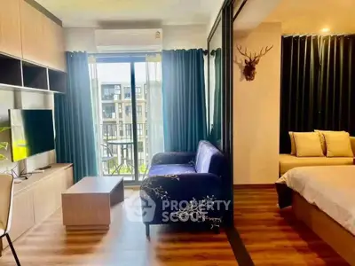 Modern living room with balcony view and stylish bedroom in open layout apartment.
