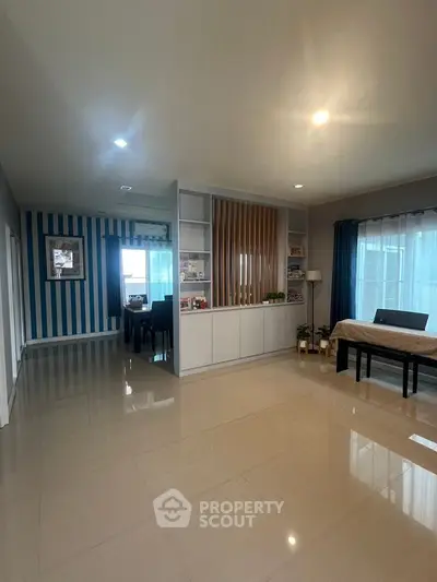 Spacious modern living room with elegant decor and ample natural light