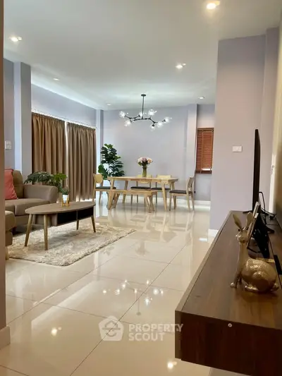 Spacious modern living room with elegant dining area and stylish decor