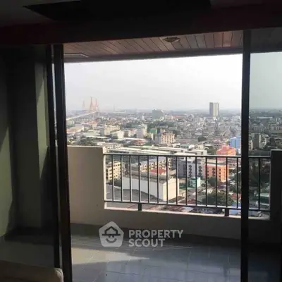 Stunning high-rise balcony view overlooking cityscape and iconic bridge, perfect for urban living.
