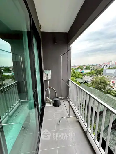 Spacious balcony with city view, ideal for relaxation and enjoying the skyline.