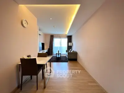 Spacious modern living room with elegant decor and ample natural light