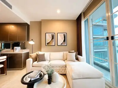 Modern living room with elegant decor and large windows in a luxury apartment.