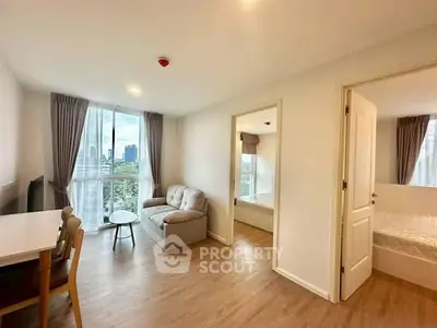 Modern apartment living room with city view and cozy furnishings