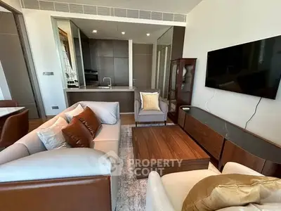 Modern living room with stylish furniture and open kitchen layout
