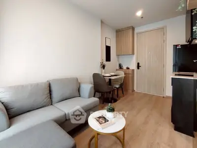 Modern living room with cozy sofa and dining area in stylish apartment