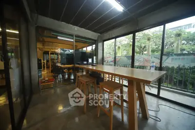 Modern office space with large windows and natural light