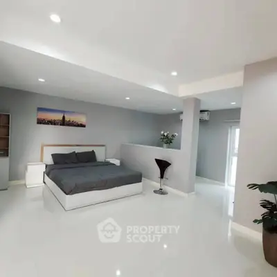 Spacious modern bedroom with sleek design and elegant decor