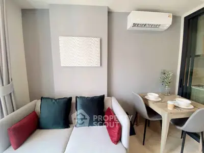 Modern living room with stylish sofa and dining area in a cozy apartment