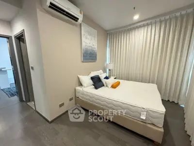 Modern bedroom with air conditioning and stylish decor in a contemporary apartment.