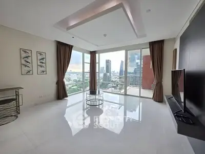 Spacious modern living room with panoramic city view and elegant decor.