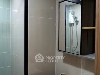 Modern bathroom with sleek shower and stylish mirror cabinet
