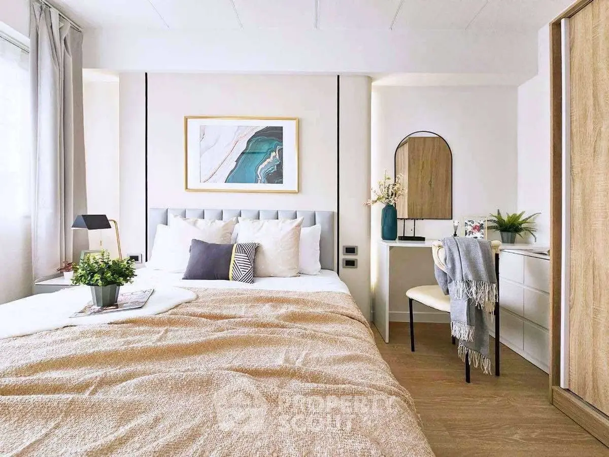 Elegant bedroom with modern decor and cozy ambiance, featuring a stylish bed and chic furniture.