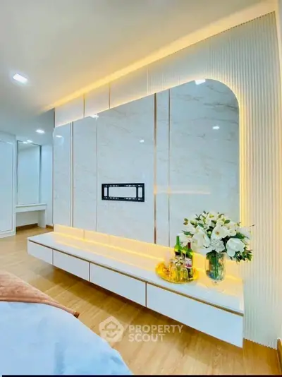 Luxurious modern living room with elegant marble wall and ambient lighting