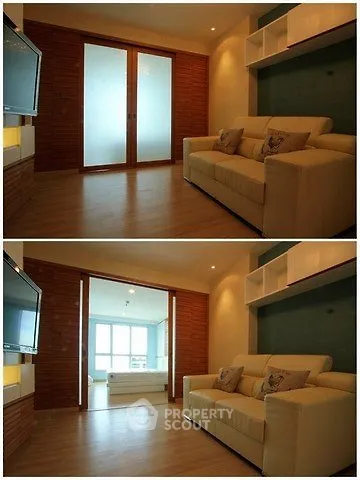 Spacious living room with modern decor and sliding doors leading to a bright area.