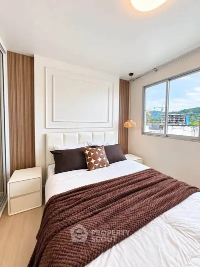 Modern bedroom with stylish decor and scenic window view