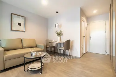 Modern living room with cozy sofa and dining area in stylish apartment.