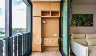 Modern apartment with a cozy balcony offering stunning city views and elegant interior design.