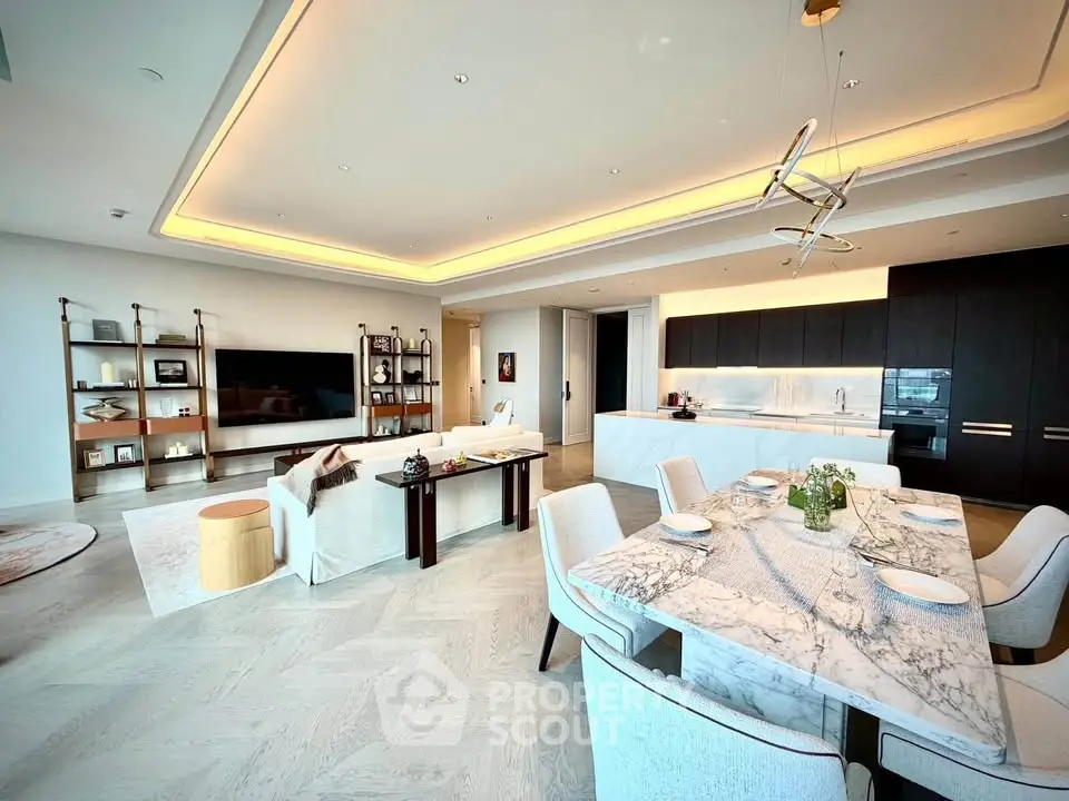 Luxurious open-plan living and dining area with modern kitchen and elegant decor