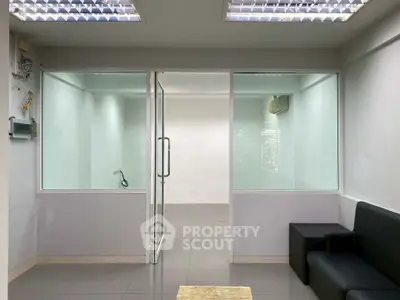 Modern office space with glass partitions and sleek design