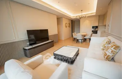 Luxurious modern living room with elegant furniture and open kitchen layout, perfect for stylish urban living.