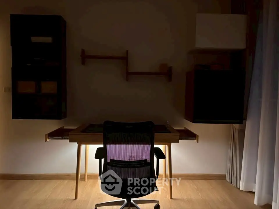Modern study room with sleek desk and ergonomic chair, perfect for productivity.