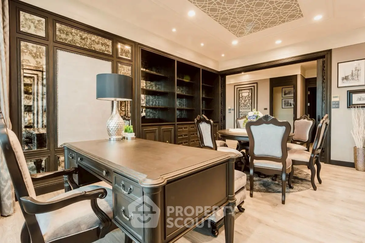 Luxurious home office with elegant wooden desk and chairs, featuring built-in bookshelves and stylish decor.