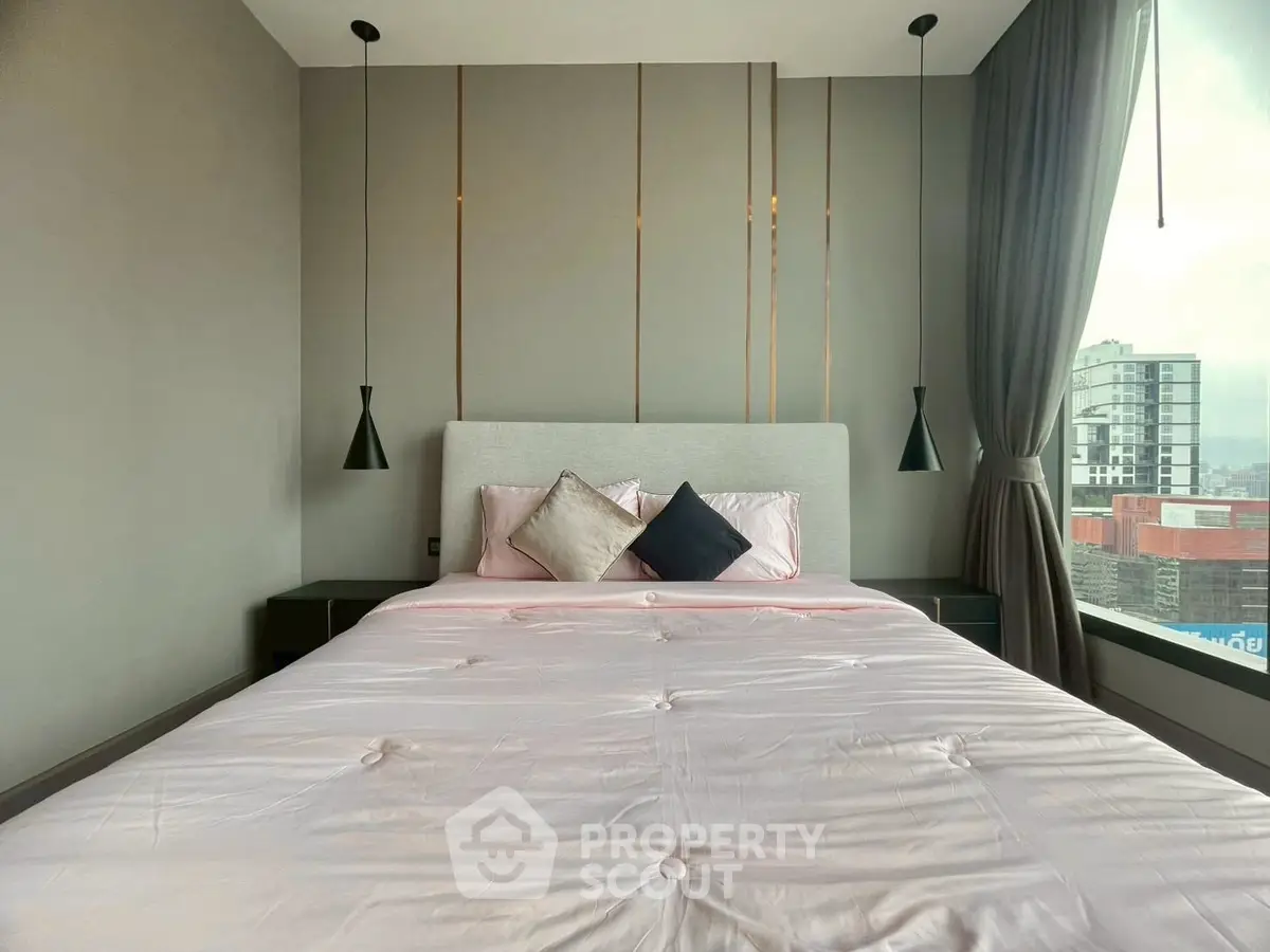 Modern bedroom with large window and stylish decor in urban apartment