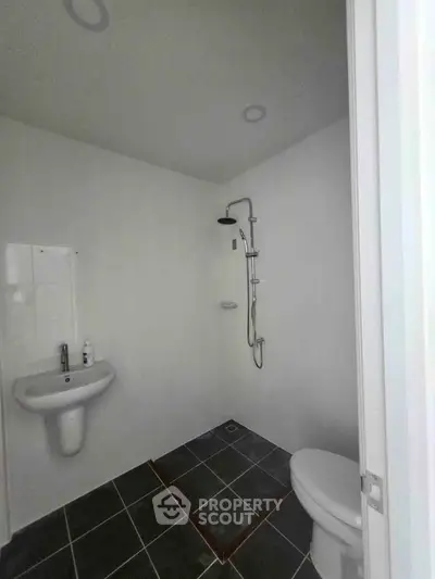 Minimalist bathroom with modern shower and sleek fixtures