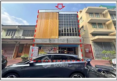Commercial building exterior with modern facade and large windows, ideal for business opportunities.