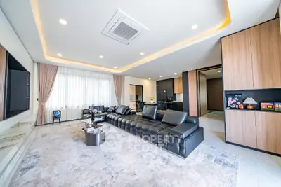 Luxurious modern living room with sleek black leather sofa and elegant decor