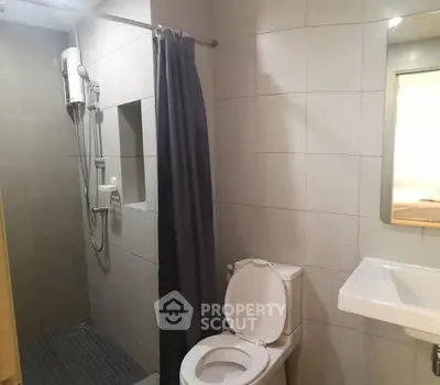 Modern bathroom with shower and toilet in sleek design