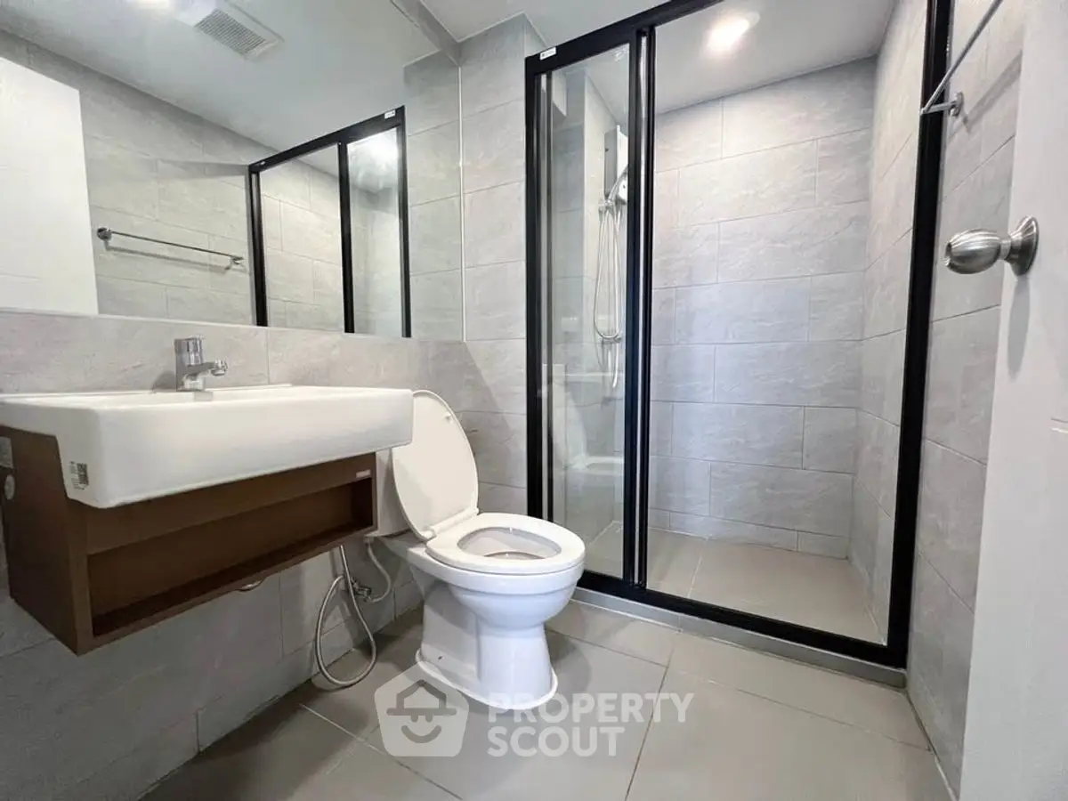 Modern bathroom with sleek design and glass shower enclosure