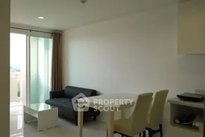 Modern living room with sleek furniture and natural light in a contemporary apartment.