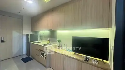 Modern kitchen with sleek cabinetry and integrated appliances in a stylish apartment.