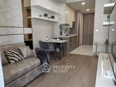 Modern living room with open kitchen layout and stylish decor